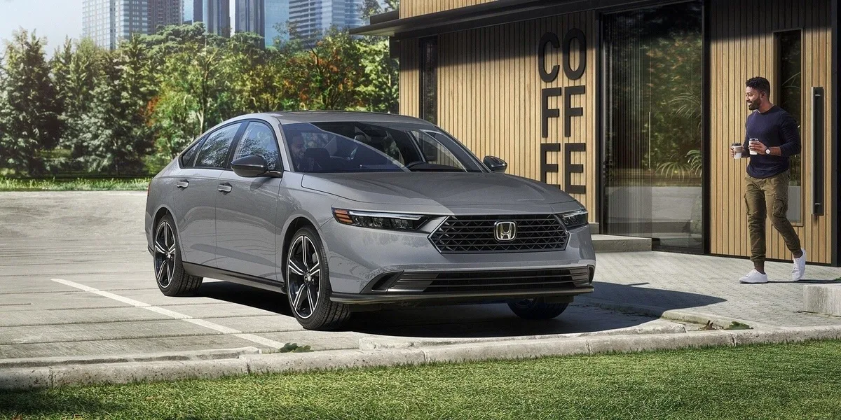 Honda Accord in gray parked on a city street, front three-quarter view