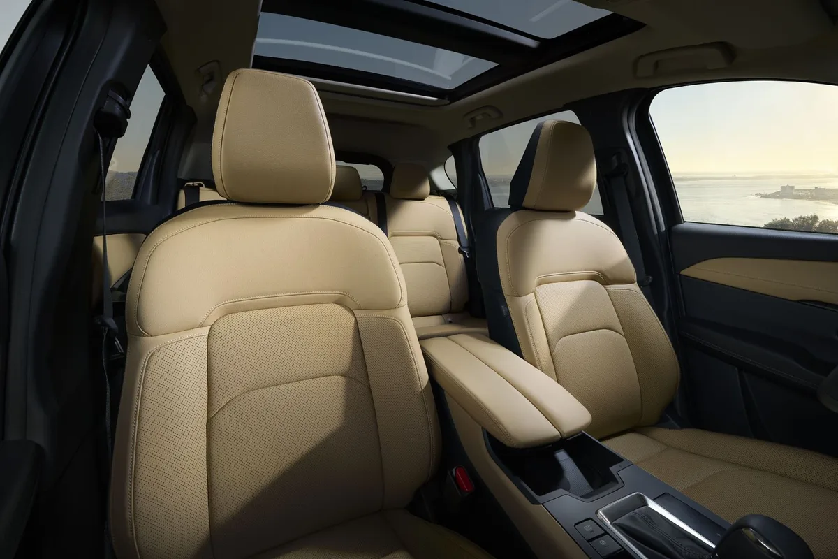 Mazda CX-5 cabin with tan leather front and rear seats and panoramic sunroof