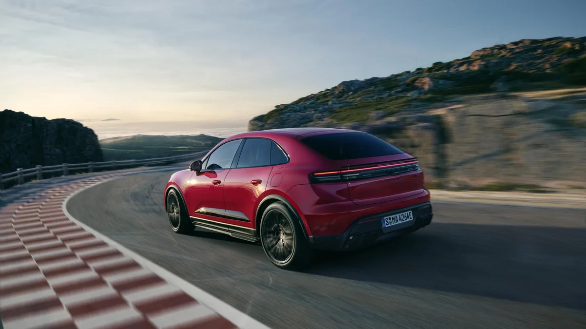 Porsche Macan Electric rear three-quarter on track